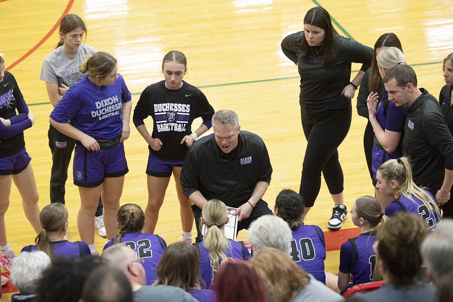 Dixon coach Luke Ravlin speaks to his team in the class 3A super sectional against Lincoln Monday, Feb. 26, 2024 at LaSalle-Peru High School.