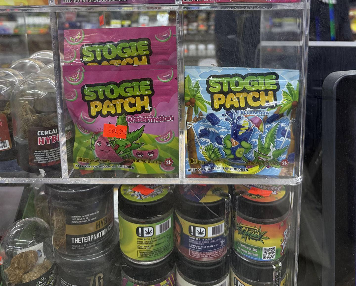In many convenience stores that sell hemp, the products are behind the counter, even though it’s not illegal to sell hemp products to minors. These packages are also labeled “21+” and “keep out of reach of children.” Critics say the design, modeled after Sour Patch Kids, is intentionally designed to appeal to children.