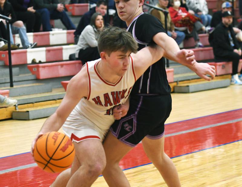 Oregon's Keaton Salsbury slips past a Rockford Lutheran defender on Friday, Feb. 6, 2026 at the Blackhawk Center.
