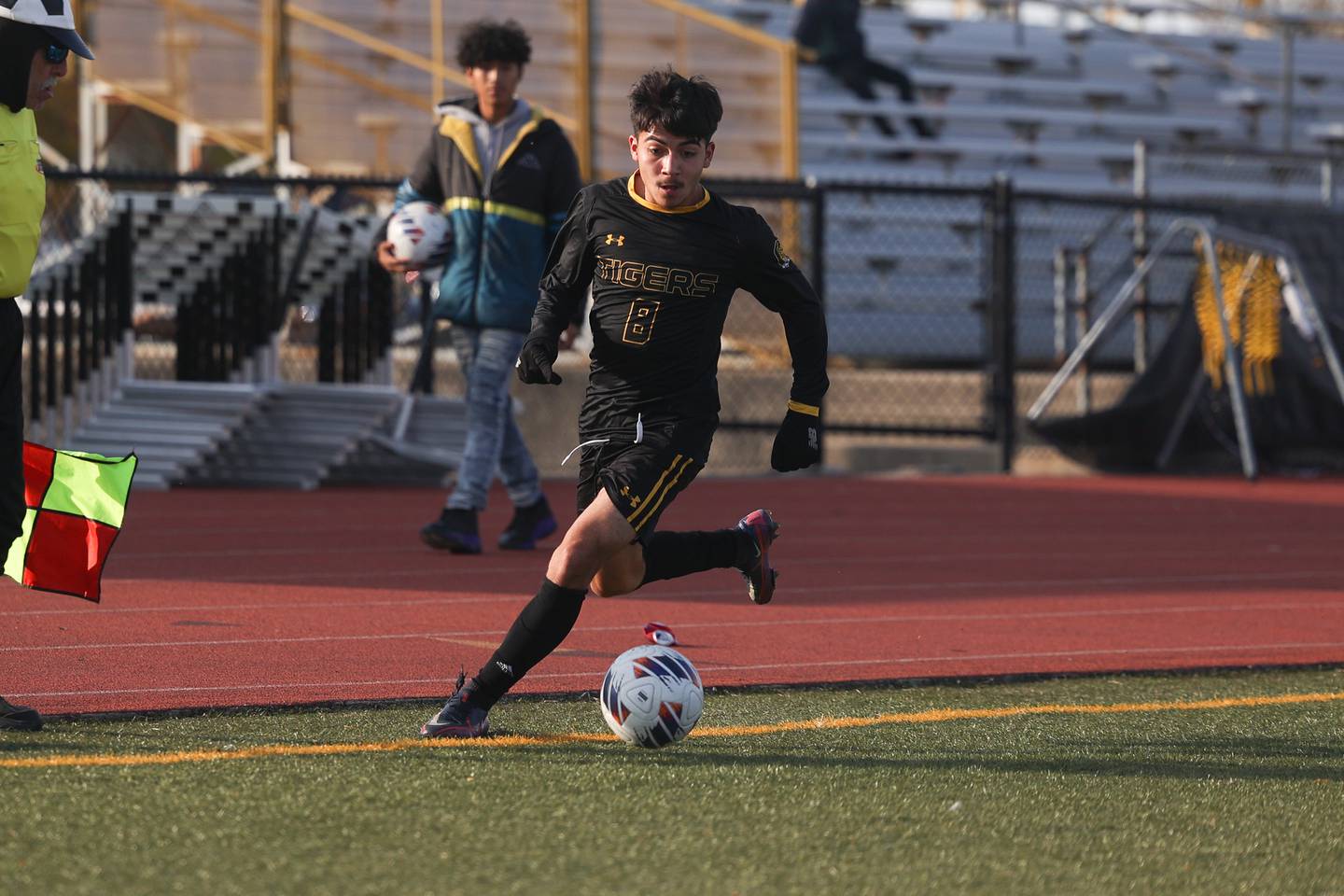 Joliet West’s Adrian Maldonado works the ball along the sidelines against East Moline United in the Class 3A Joliet West Regional semifinal on Tuesday.