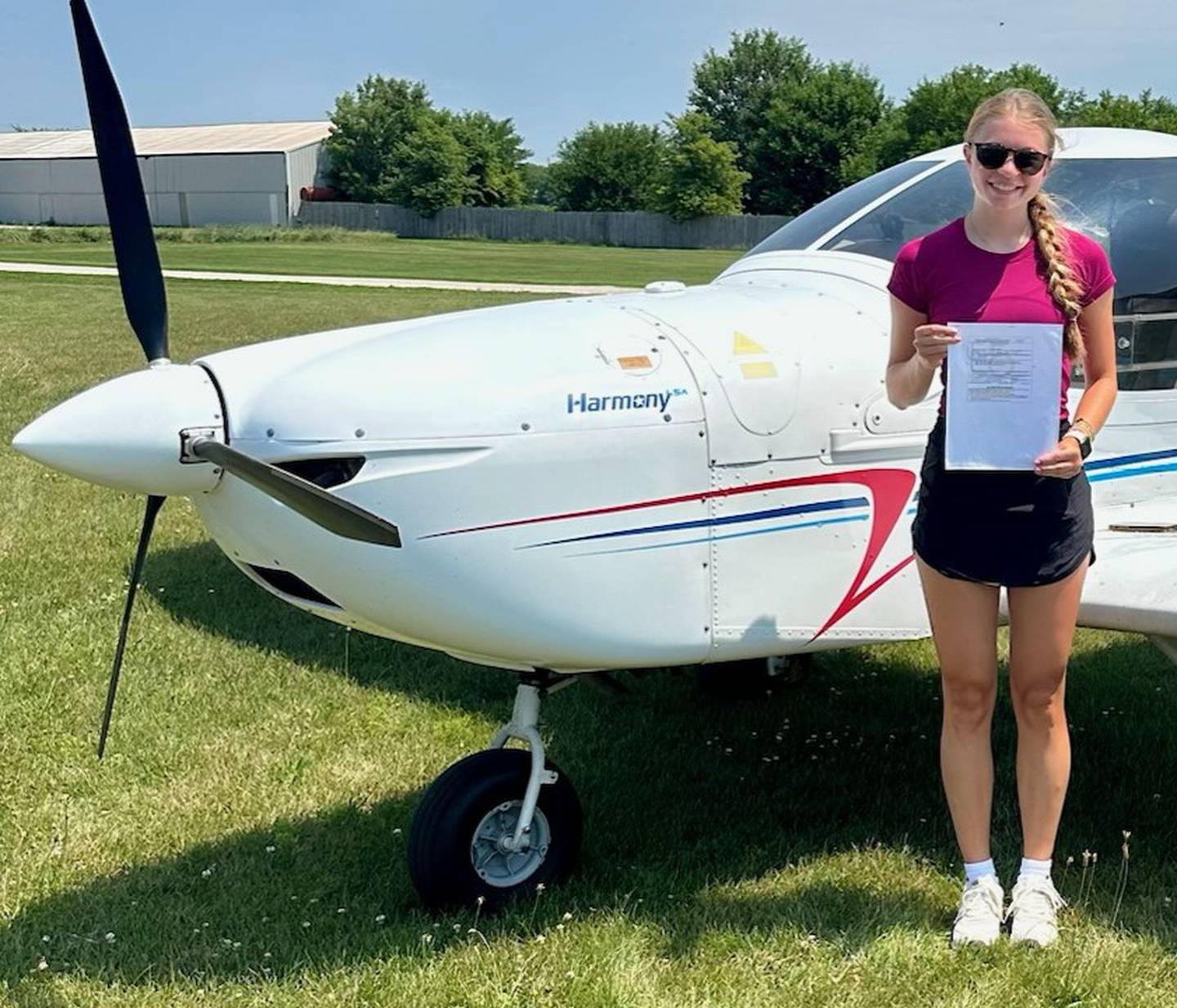 Lily Keutzer last summer at Cushing Field with her private pilot’s license.