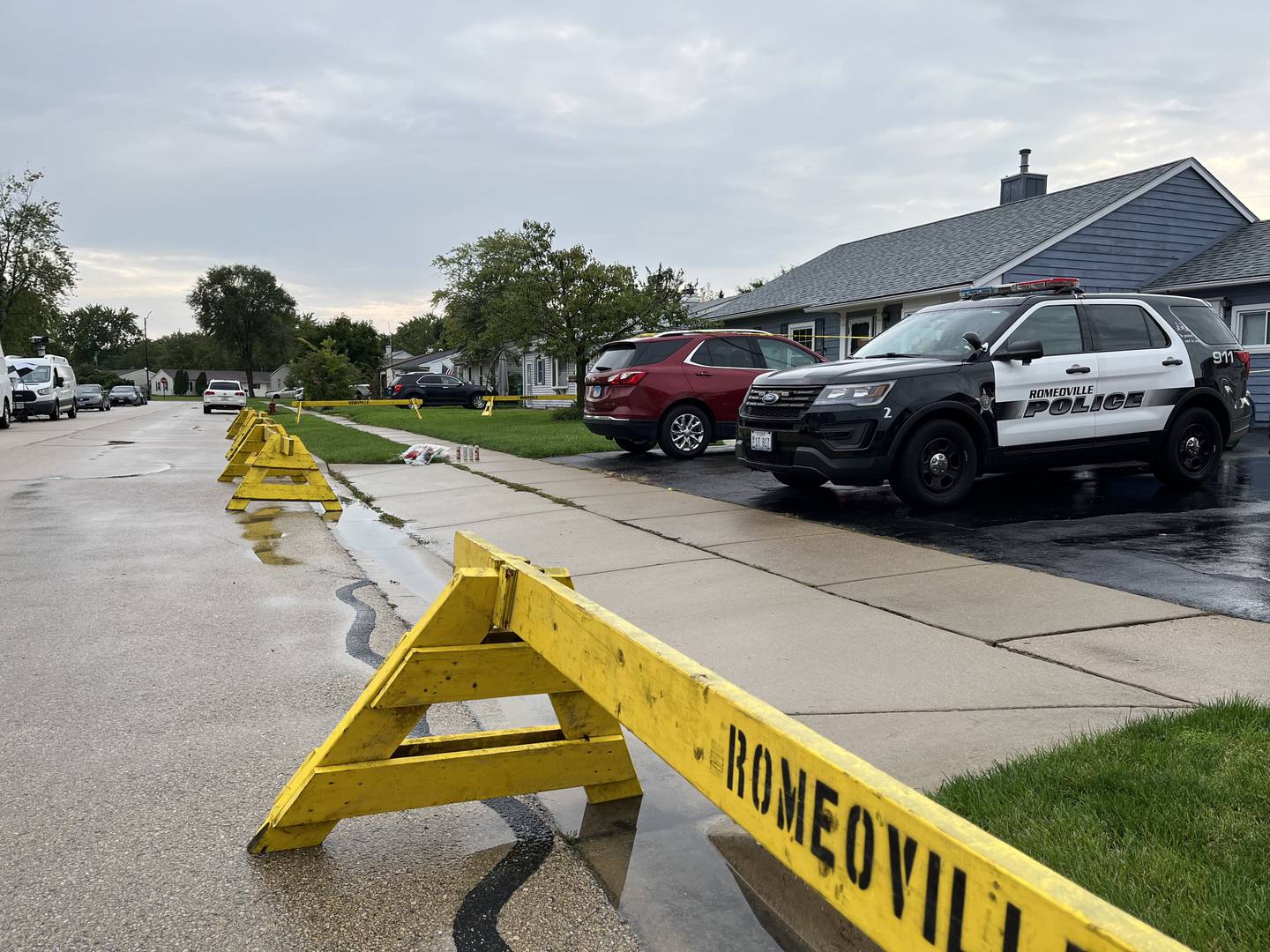 A Romeoville police squad vehicle is seen on Tuesday, Sept. 19, 2023, in the driveway of a residence in the 500 block of Concord Avenue in Romeoville. On Sunday, Sept. 17, officers discovered the bodies of Alberto Rolon, 38, Zoraida Bartolomei, 32, and their two sons, ages 7 and 9, inside the residence. Police are investigating their deaths as homicides.
