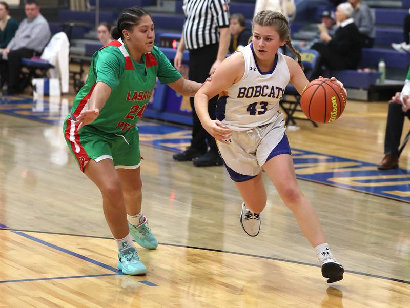 Somonauk's Kiley Mason drives by LaSalle-Peru's Jasmine Garman during their game Thursday, Nov. 16, 2023, in the Tim Humes Breakout girls basketball tournament at Somonauk High School.