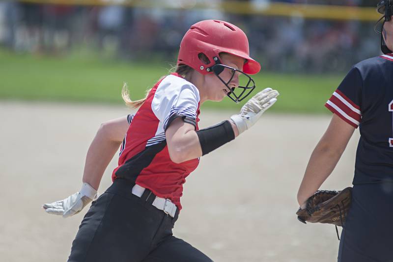 Forreston’s Kara Erdman rounds third to score against West Central Monday, May 30, 2022.