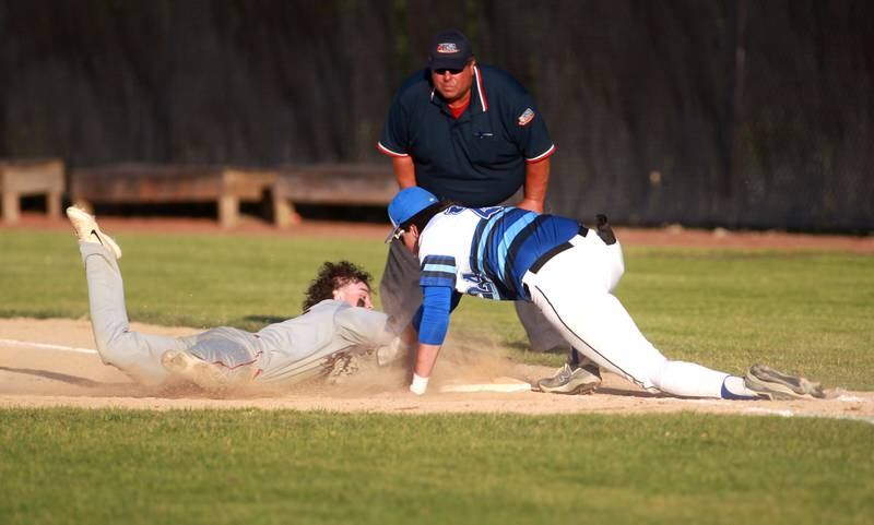 St. Charles North first baseman Colin Ryder tags South Elgin’s Aedon Segovia out at first during a Class 4A St. Charles North Sectional semifinal game on Wednesday, May 29, 2024.