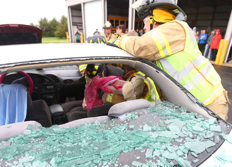 Brynn Pennington a student at Leland High School, is carefully removed from a vehicle during a Mock Prom drill at Leland High School on Friday, May 6, 2022 in Leland.