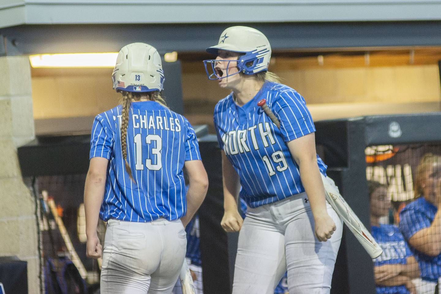 St Charles North’s Megan Bauwens screams after teammate Margo Geary scores the first run of the game against Edwardsville Friday, June 10, 2022 in the class 4A IHSA state softball semifinal game.
