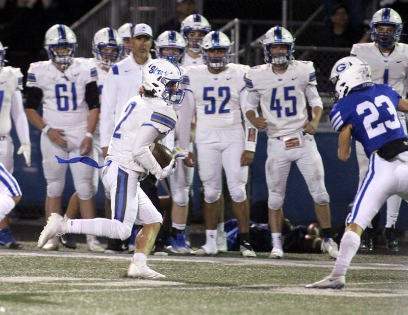 St. Charles North’s Brody Geary (2) runs the ball during a game at Geneva on Friday, Sept. 23, 2022.