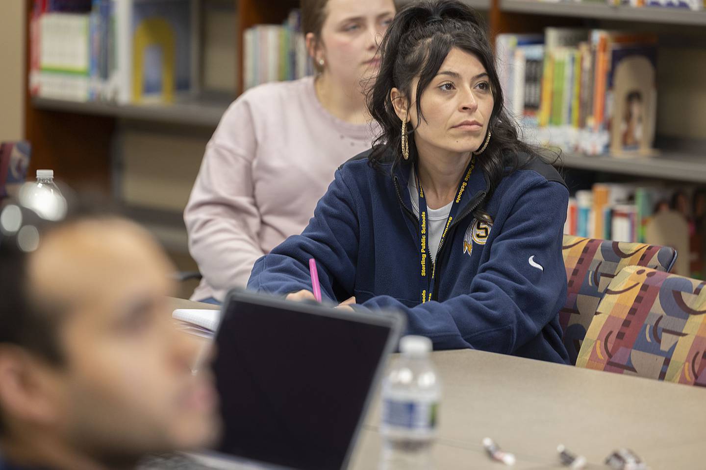 Sterling School’s paraprofessionals attend a meeting Friday, April 21, 2023. about SPS University, a program meant to fast track those who want to full time teachers.