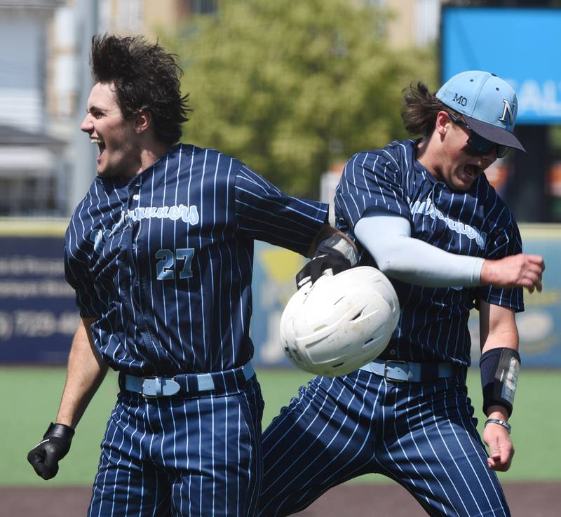 Joe Lewnard/jlewnard@dailyherald.com
Nazareth’s David Cox, left, celebrates his sixth-inning home run with teammate Lucas Smith during the Class 3A  state championship baseball game in Joliet Saturday.