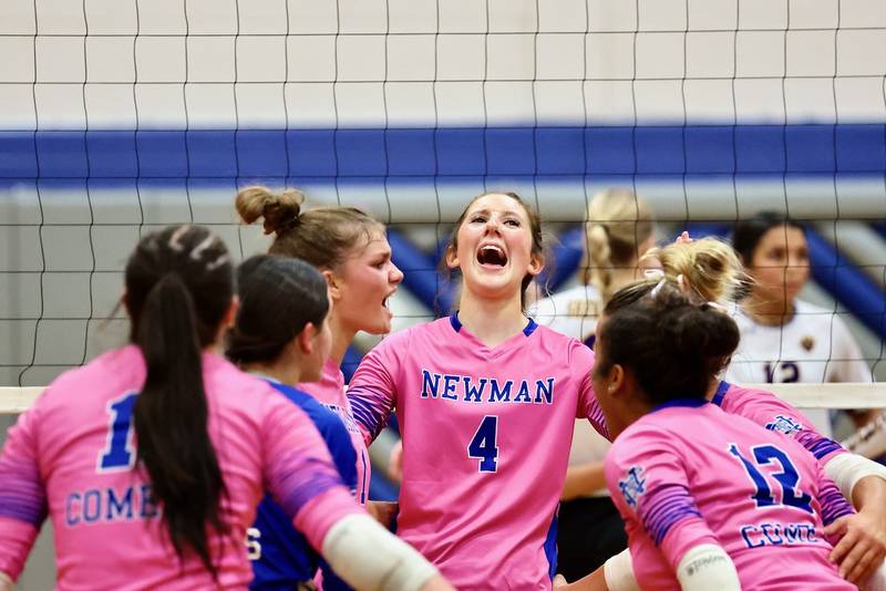 Newman sophomore Ruby Burger (4) and the Comets celebrate Tuesday's semifinal upset over No. 2 Sherrard at the Princeton Regional.