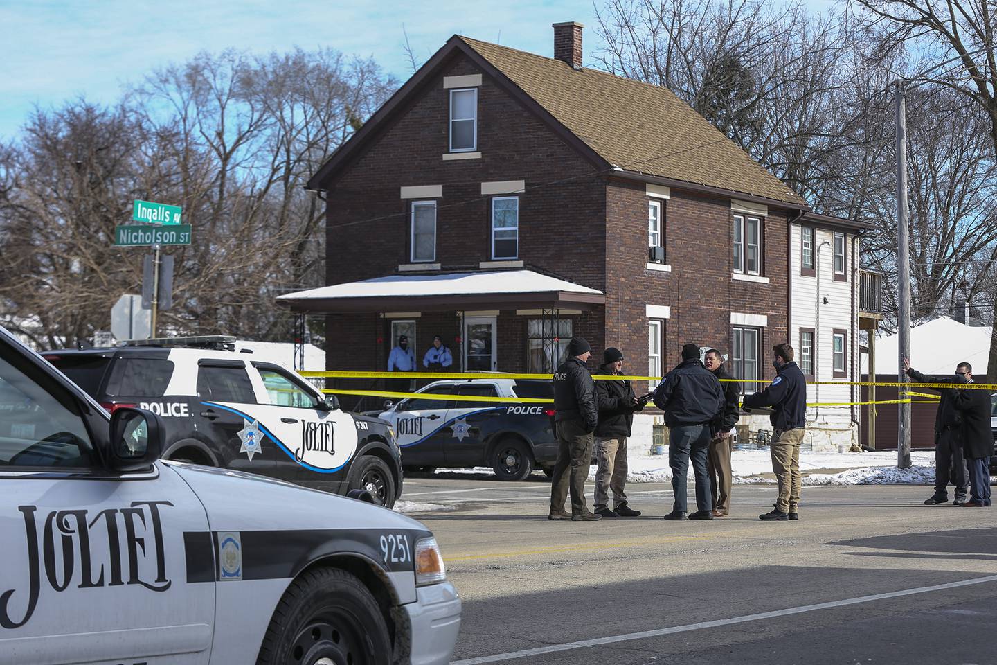 Police gather at the intersection of Ingalls Avenue and Nicholson Street after an officer implicated a shooting that took place Thursday, January 28, 2021 in Joliet, Illinois.