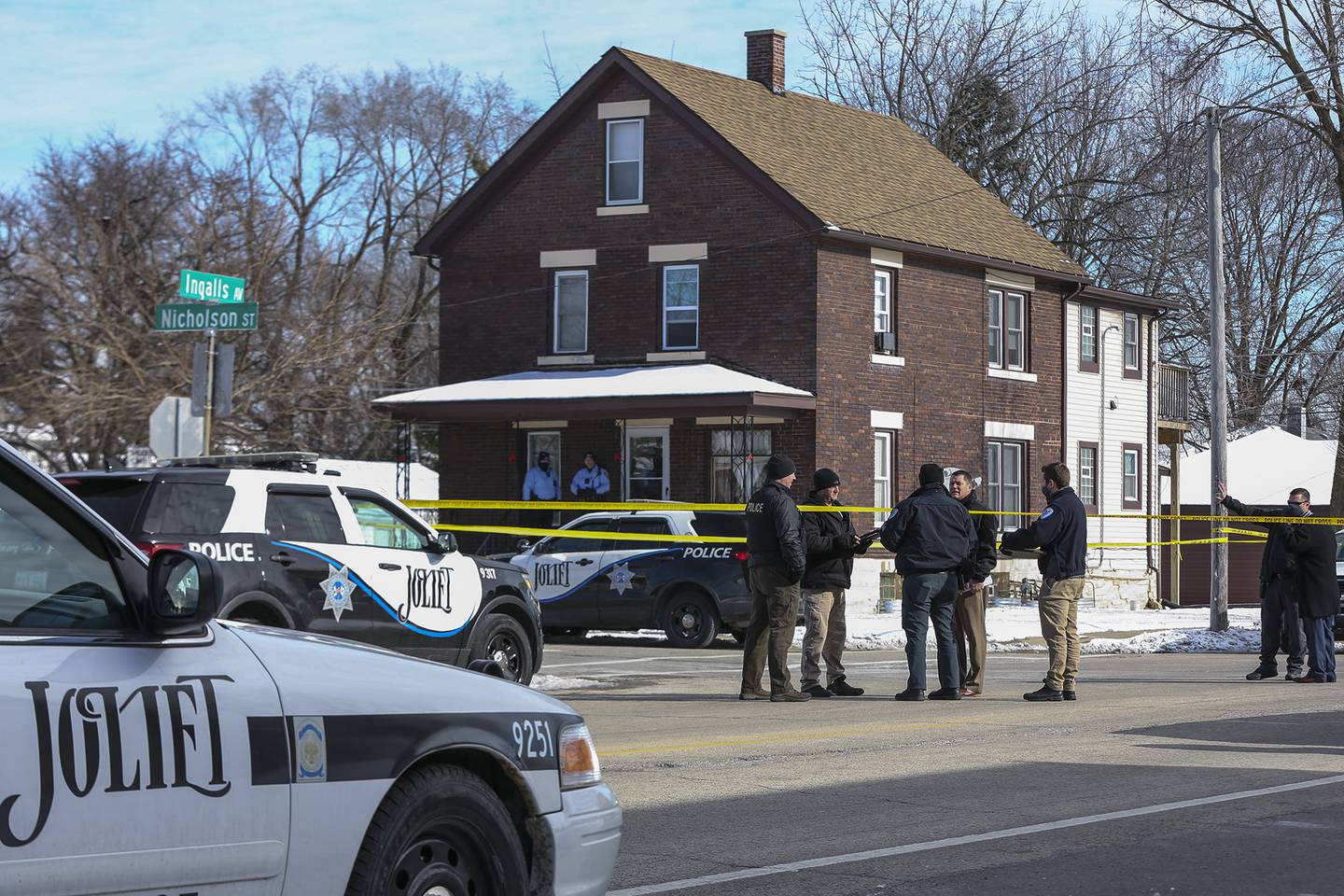 Police gather at the intersection of Ingalls Ave. and Nicholson St. after an officer involved shooting that took place on Thursday, Jan. 28, 2021, in Joliet, Ill.