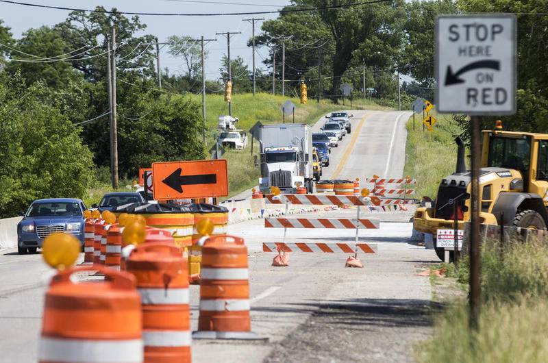 Vehicles drive past bridge construction on Route 14 near Bunker Hill Road in Woodstock Friday, June 23, 2017.