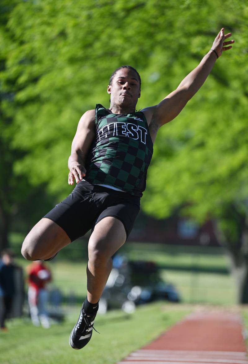 Glenbard West's Jamarcus Kelly competes in long jump during the Class 3A Lake Park boys track and field sectional on Friday, May 23, 2025 in Roselle.