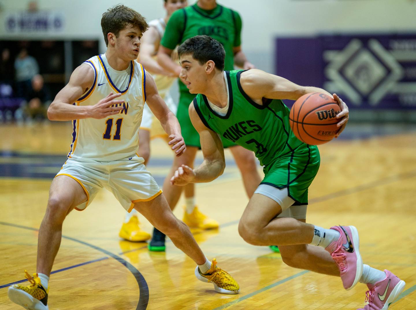 York's A.J. Levine (3) plays the ball on the wing against Downers Grove North's Owen Thulin (11) during a basketball game at Downers Grove North High School on Friday, Dec 9, 2022.