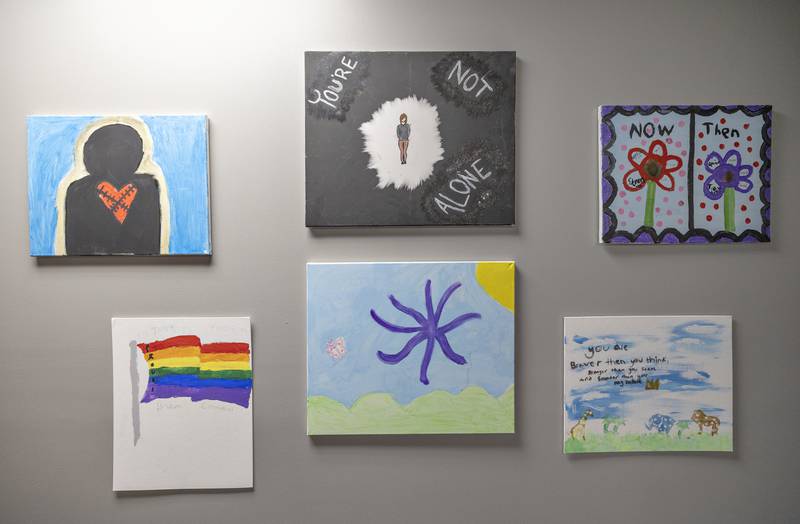 Art hangs on the wall Wednesday, July 23, 2025, made by children helped by Shining Star.