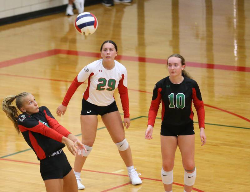 L-P's Kaylee Abens returns the ball while teammates Marissa Sanchez and Katie Sowers watches on Tuesday, Aug. 22, 2023 in Sellett Gymnasium.