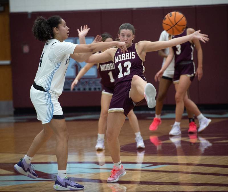 Morris's Tessa Shannon, center, guards Kankakee's Malea Harrison, right, in a game on Tuesday, January 27, 2026.