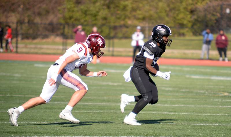 Fenwick's Jalen Morgan runs the field against Brother Rice's defense during their playoff game Saturday, Nov. 2, 2024.