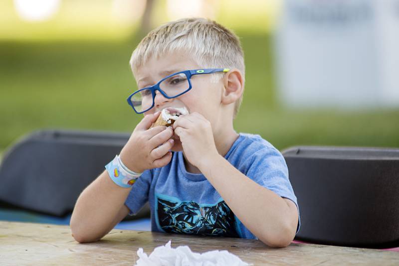 Anthony Yepsen, 5, digs into the last few bites of his ice cream treat Friday, July 1, 2022 during the Petunia Fest ice cream social.