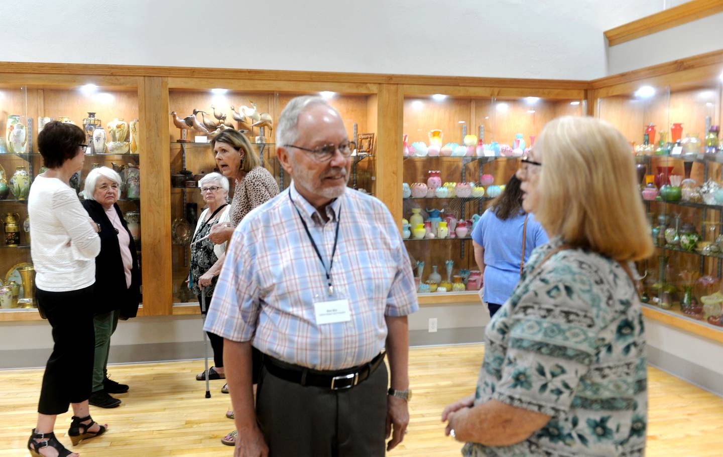 Ron Bry, vice president of the CMAAA Foundation, speaks with Rosemary Underwood during the museum's grand opening on Friday, July 14, 2023.