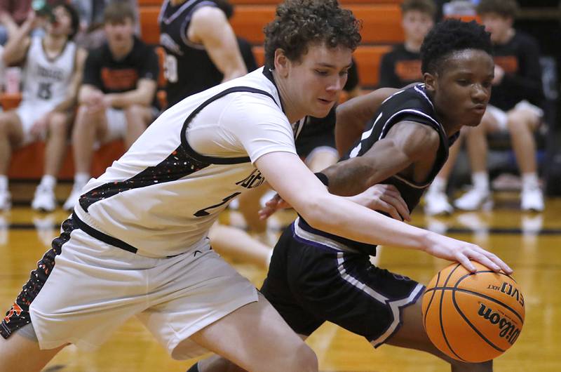Crystal Lake Central's Danny Spychala gets to a loose ball in front of Hampshire's Chayse Gray during a a Fox Valley Conference basketball game on Friday, Feb. 7, 2025, at Crystal Lake Central High School.