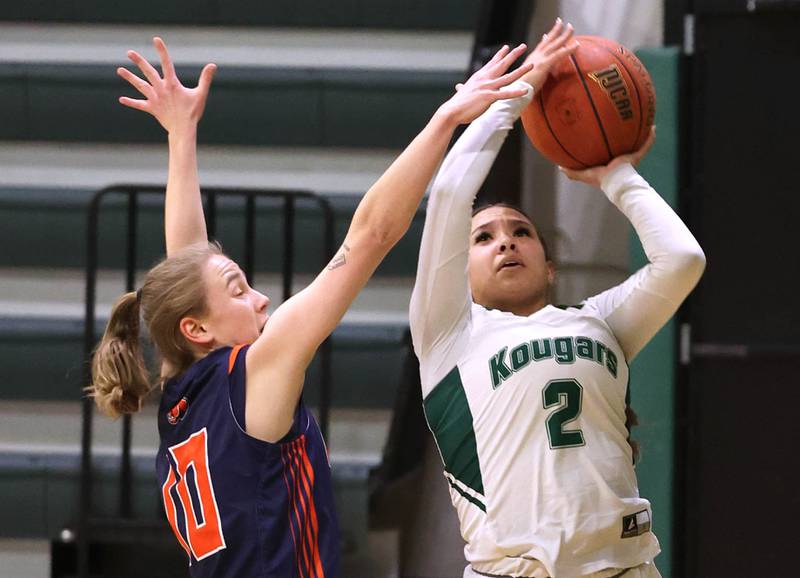 Kishwaukee College's Ariana Smith shoots over Highland Community College's Ariadna Kuc during their game Thursday, Jan. 11, 2024, at Kishwaukee College in Malta.