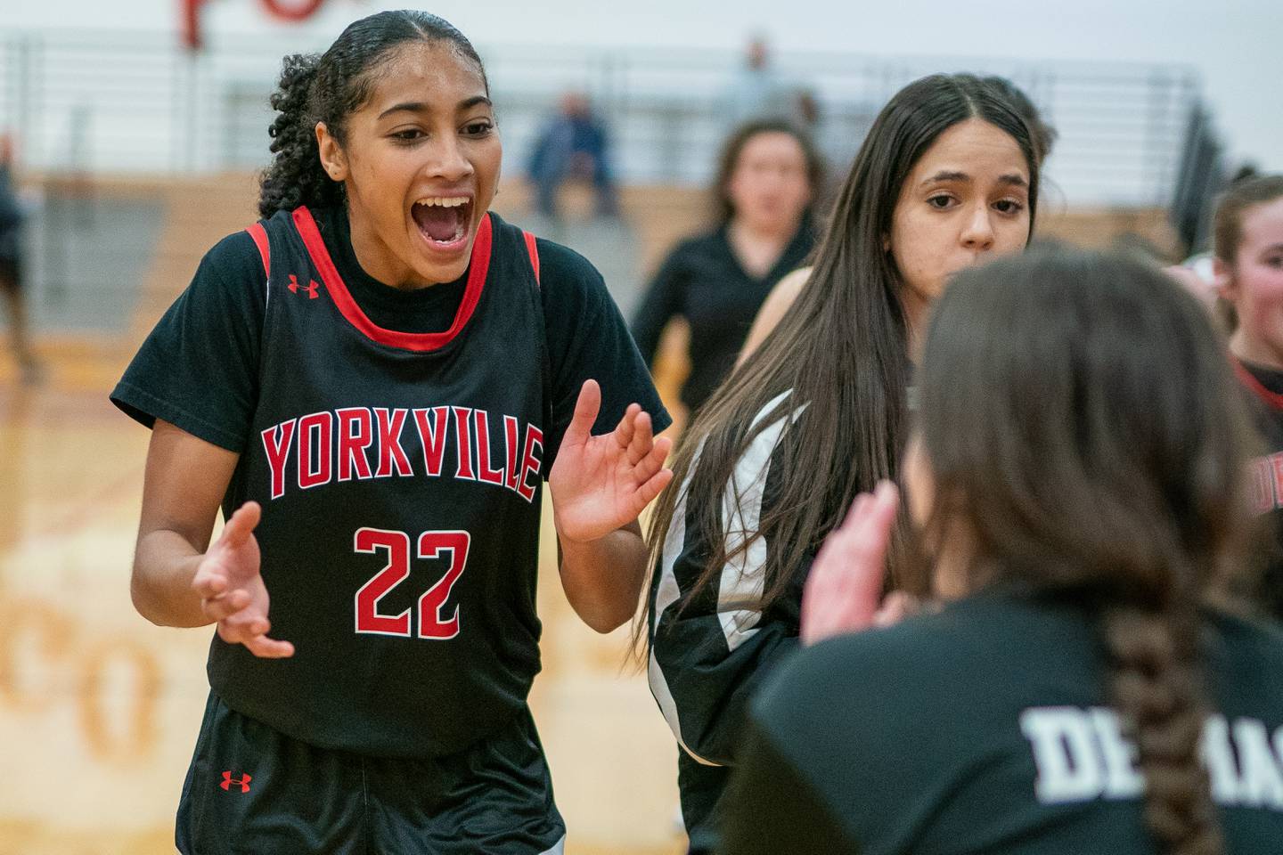 Yorkville's Alexandra Stewart (22) celebrates after defeating Plainfield North in a Yorkville girls 4A regional semifinal basketball game at Yorkville High School on Tuesday, Feb 14, 2023.
