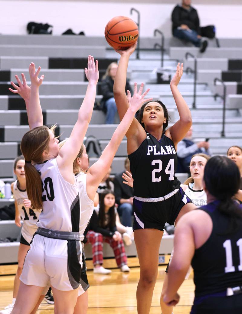 Plano’s Mikayla Walls shoots over Kaneland’s Sam Kerry during their game Tuesday, Dec. 13, 2022, at Kaneland High School in Maple Park.