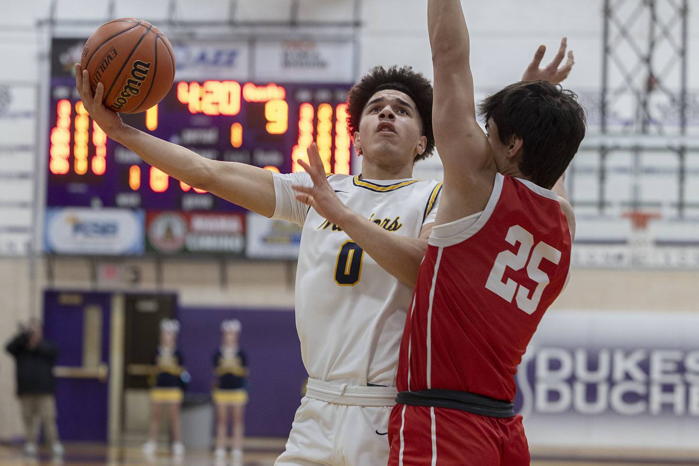 Sterling’s Andre Klaver puts up as shot against Ottawa’sPayton Knoll in the regional final Friday, Feb. 24, 2023.