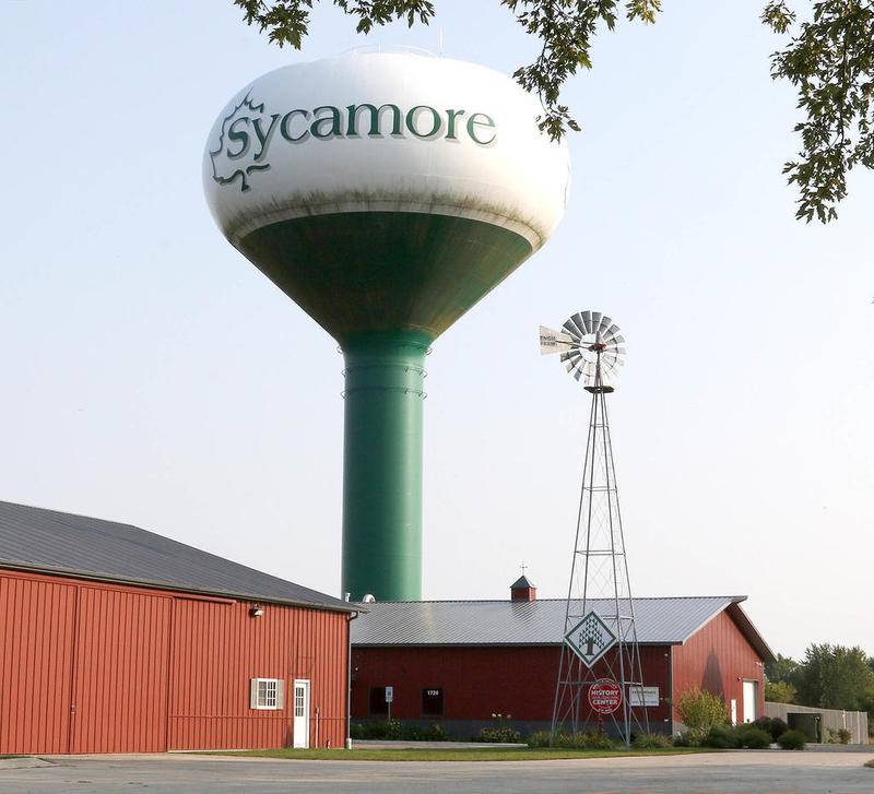 The Sycamore water tower rises over the barns on the grounds of the Sycamore History Museum.