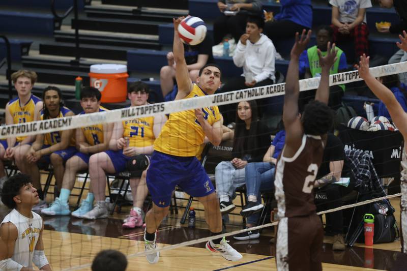 Joliet Central’s Ian Guzman hits a shot against Joliet Catholic on Wednesday, April 1, 2026 in Joliet.
