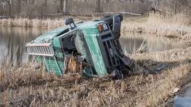 Car crashes through guardrail and into marsh near Woodstock 
