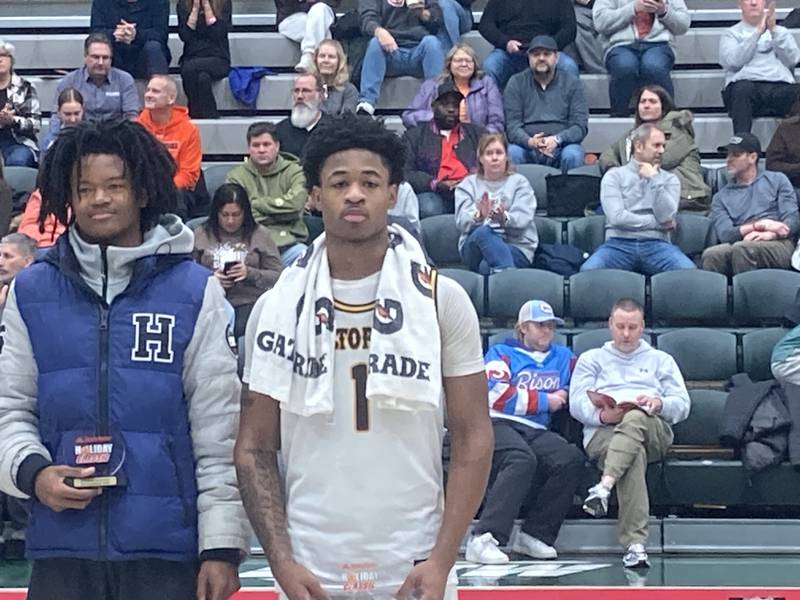 Joliet Catholic's Jayden Armstrong (right) stands next to Bloomington Central Catholic's Keshaun Manney (left).