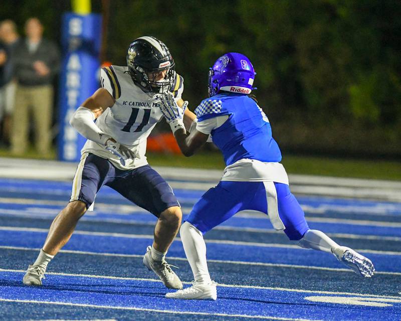 IC Catholic Prep's Grant Bowen (11) defends St. Francis's Javonte Williams (8) during the game on Friday Oct. 3, 2025, held at St. Francis High School.