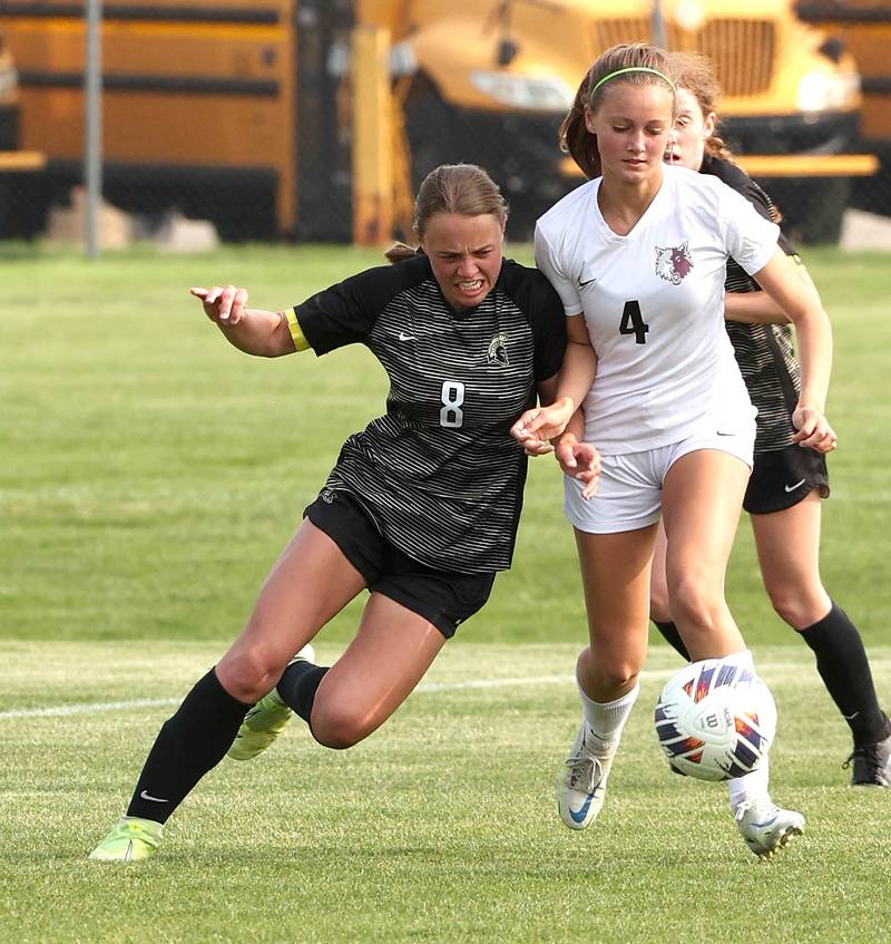 Sycamore's Anna Lochbaum (left) and Prairie Ridge's Emily Gorton collide going after the ball during their game Wednesday, May 17, 2023, at Sycamore High School.