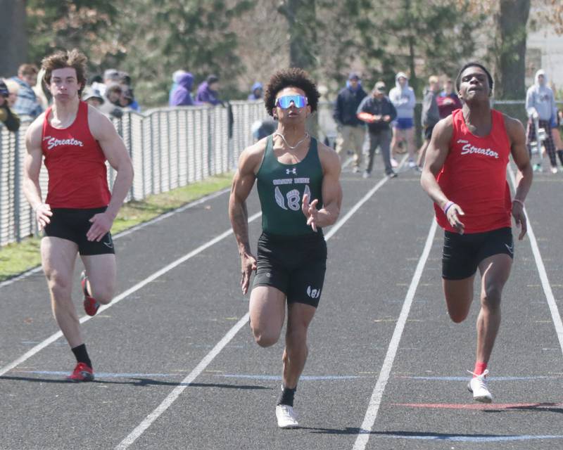 St. Bede's Tyreke Fortney (center) wins the boys 100 meter dash as Streator's Cade Stevens (left) and Aneefy Ford trail behind during the Rollie Morris Invite on Saturday, April 16, 2022 at Hall High School in Spring Valley.