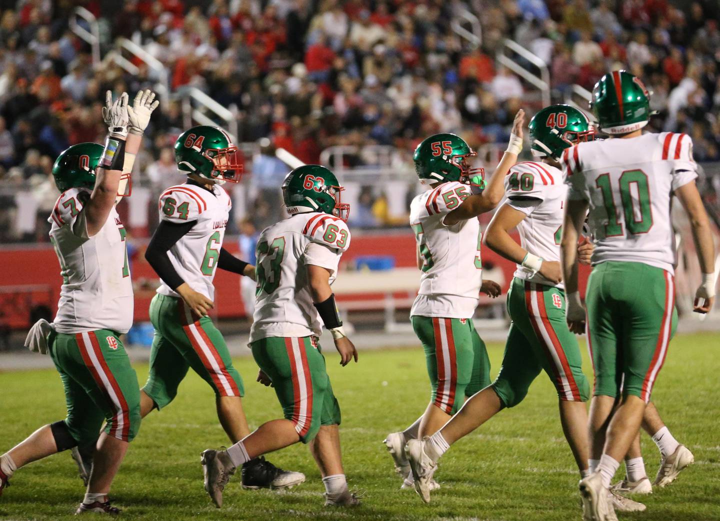 Members of the L-P football team celebrate after scoring a touchdown against Ottawa on Friday, Oct. 4, 2024 at King Field.
