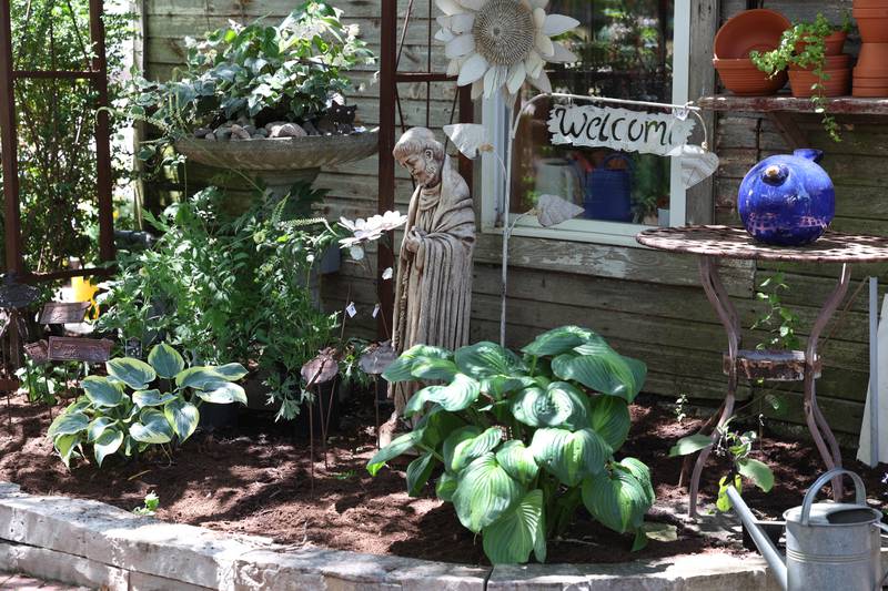 The outside area at Blumen Gardens is decorated with plants and artwork making every shopping trip to the facility a pleasant experience.