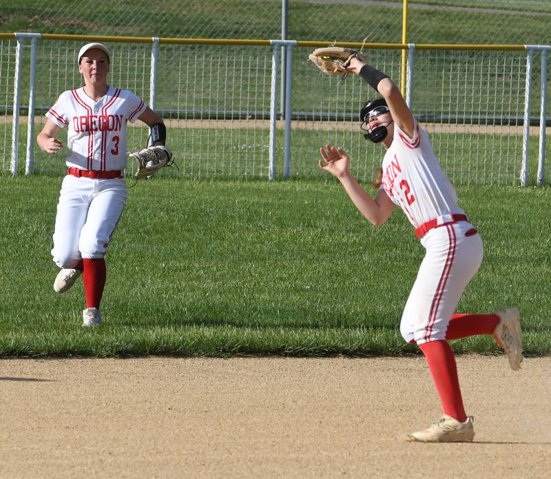Oregon's Lola Schwarz makes a catch for an out as Avery Young backs up the play against Somonauk at the 2A Oregon Regional on Wednesday, May 20, 2026.