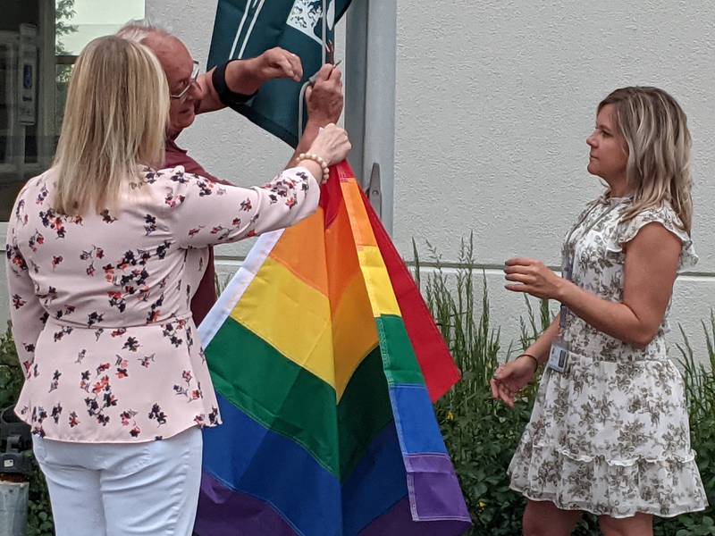 Assisted by two city staff members, St. Charles Mayor Lora Vitek on Wednesday raised the first Pride flag in the city’s history.