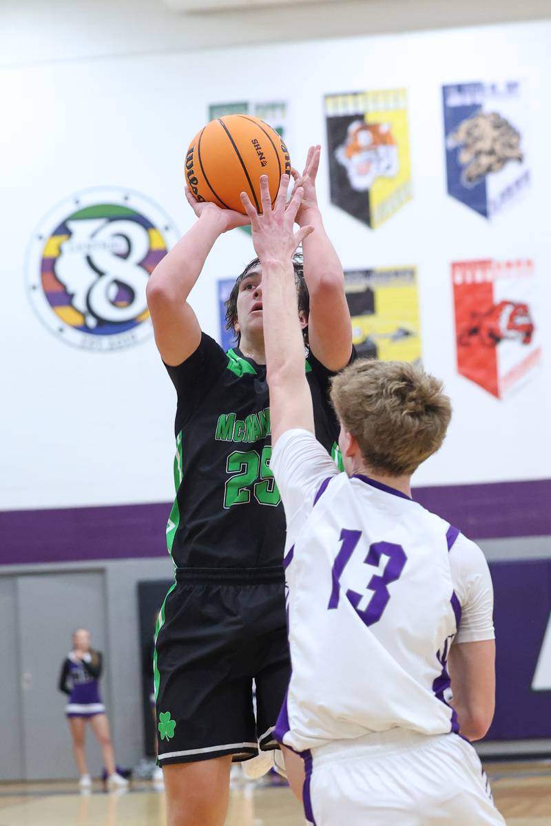 Bishop McNamara's Niko Kolokthas shoots under pressure from Manteno's Ramsey Owens during the Fightin' Irish's 61-24 victory over Manteno on Tuesday, Jan. 13, 2026.