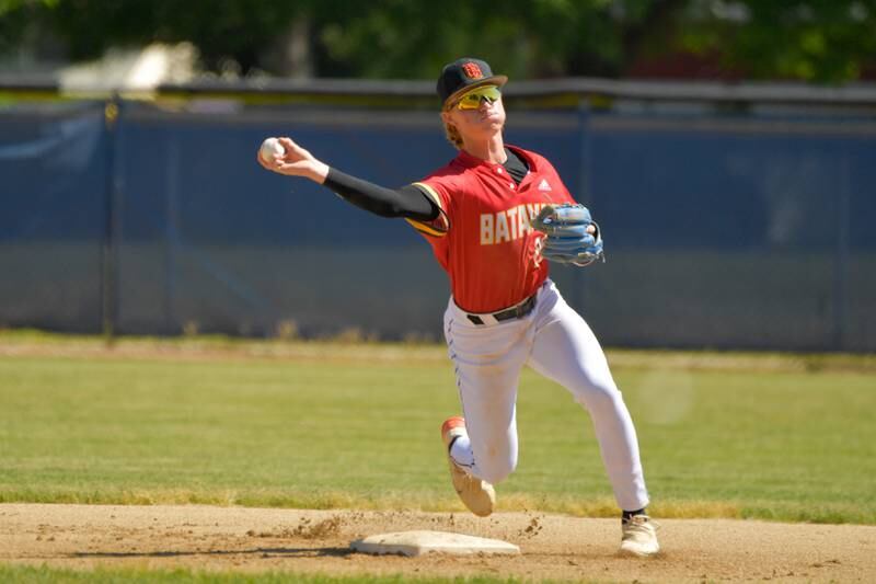 Batavia's Jackson Bland (26) makes the throw to 1st against St. Charles North during the Geneva Regional Championship on Saturday, May 27, 2023.