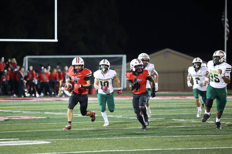 Bradley-Bourbonnais' Isaac Allison, left, breaks away up the sideline for a first down during the Boilermakers' 35-6 victory over Waubonsie Valley Friday, Sept. 12, 2025.