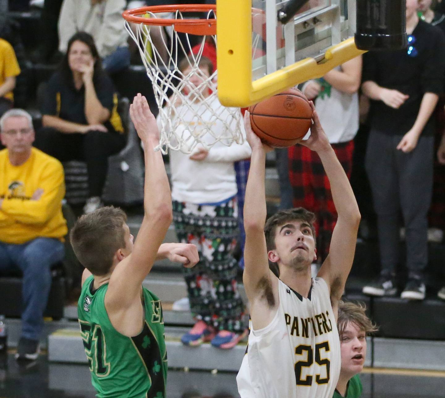 Putnam County's Wyatt Grimshaw pulls up under the hoop to shoot a shot over Seneca's Lane Provance on Friday, Dec. 16, 2022 at Putnam County High School.