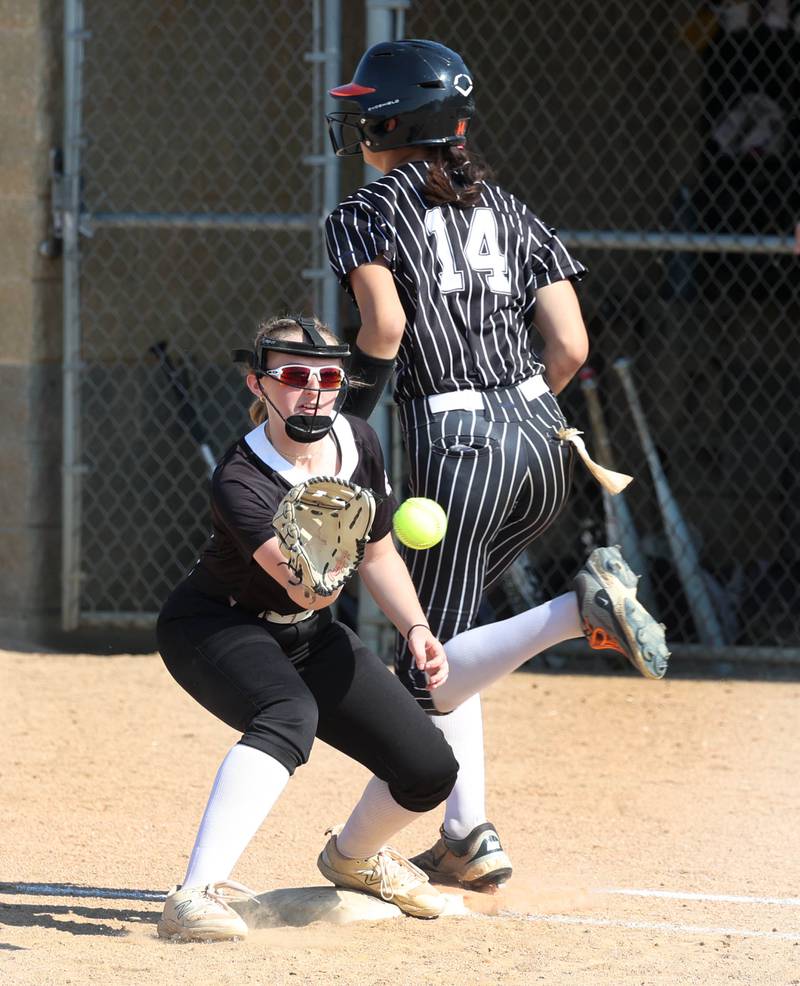 Crystal Lake Central's Lily Perocho beats the throw to Prairie Ridge's Mary-Kate Center for an infield single Friday, June 6, 2025, during their Class 3A sectional final game at Sycamore High School.