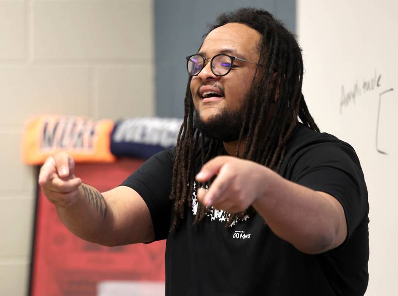 Devonte Merrick, assistant band director at DeKalb High School, talks about the science of sound Saturday, April 5, 2025, during Barb STEAMCon at Dekalb High School. The event featured sessions focusing on the areas of science, technology, engineering, arts and math.