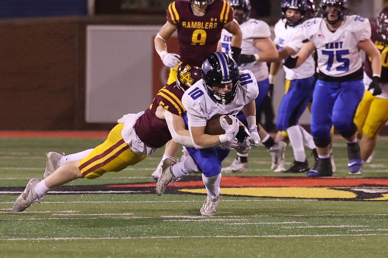 Lincoln-Way East’s Cade Serauskis lunges forward for extra yards after a catch against Loyola in the Class 8A championship on Saturday, Nov. 25, 2023 at Hancock Stadium in Normal.