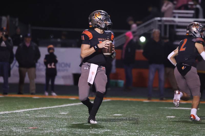 Minooka’s Gavin Dooley looks to pass against Plainfield North. Friday, Oct. 7, 2022, in Minooka.